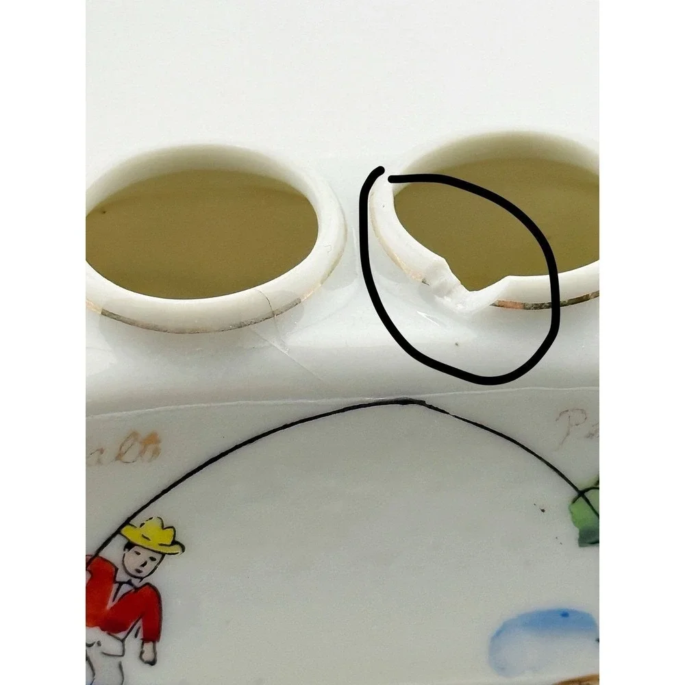 Vintage Japanese 1950's fish nodder salt & pepper shakers. Base shows fishing